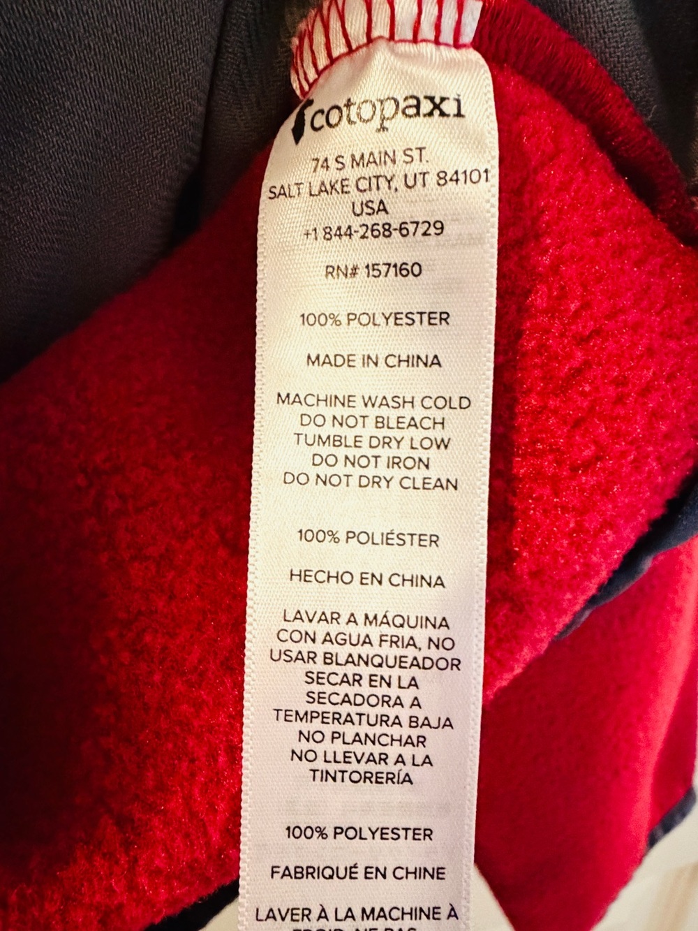 cotopaxi Red Fleece Jacket with Orange, Yellow & Blue Stripes - Picture 3 of 5
